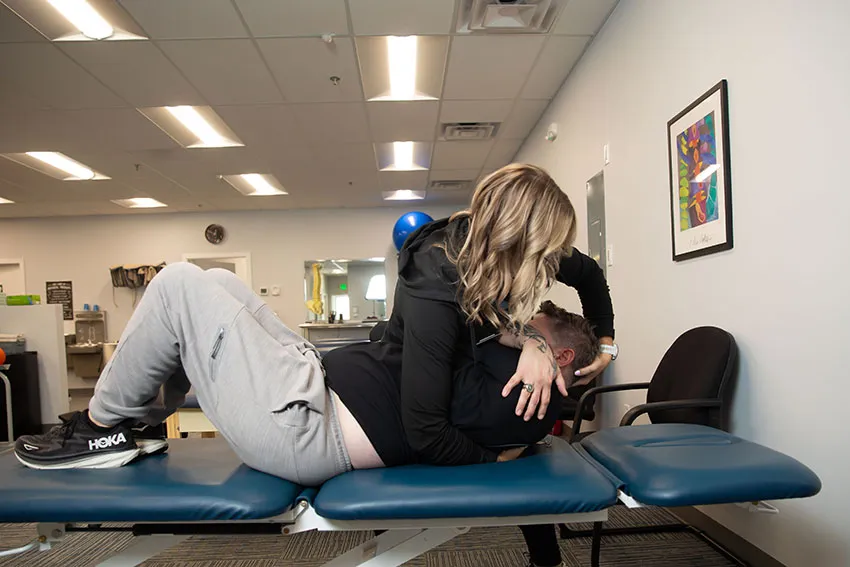 Therapist performing a lumbar manipulation in Salisbury, Maryland